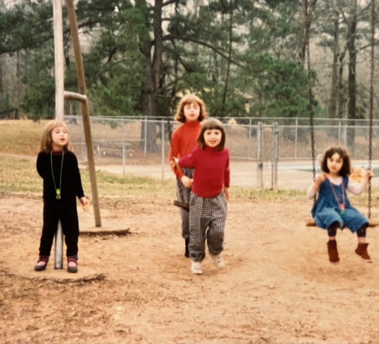 Jessie Streich-Kest, Aileen Talbott-Kelleher, Ryan Talbott-Kelleher, and Anna Poe-Kest play at ACORN Year End mtg, 1992