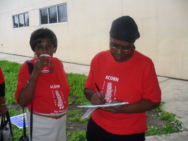 Photograph of New Orleans ACORN members wearing red T-shits that say, “Save the Lower 9” (photo credit: Tanya Harris-Glasow or Marie Hurt).