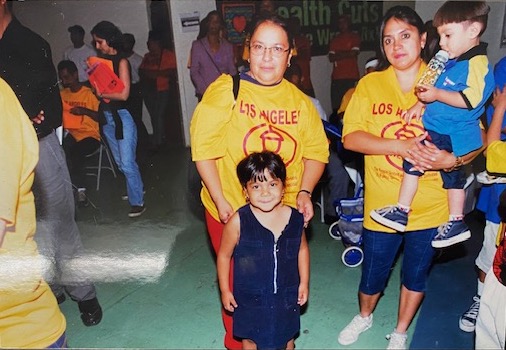 Photograph of ACORN member/leader Lupita Gonzalez and others in Los Angeles ACORN T-shirts.