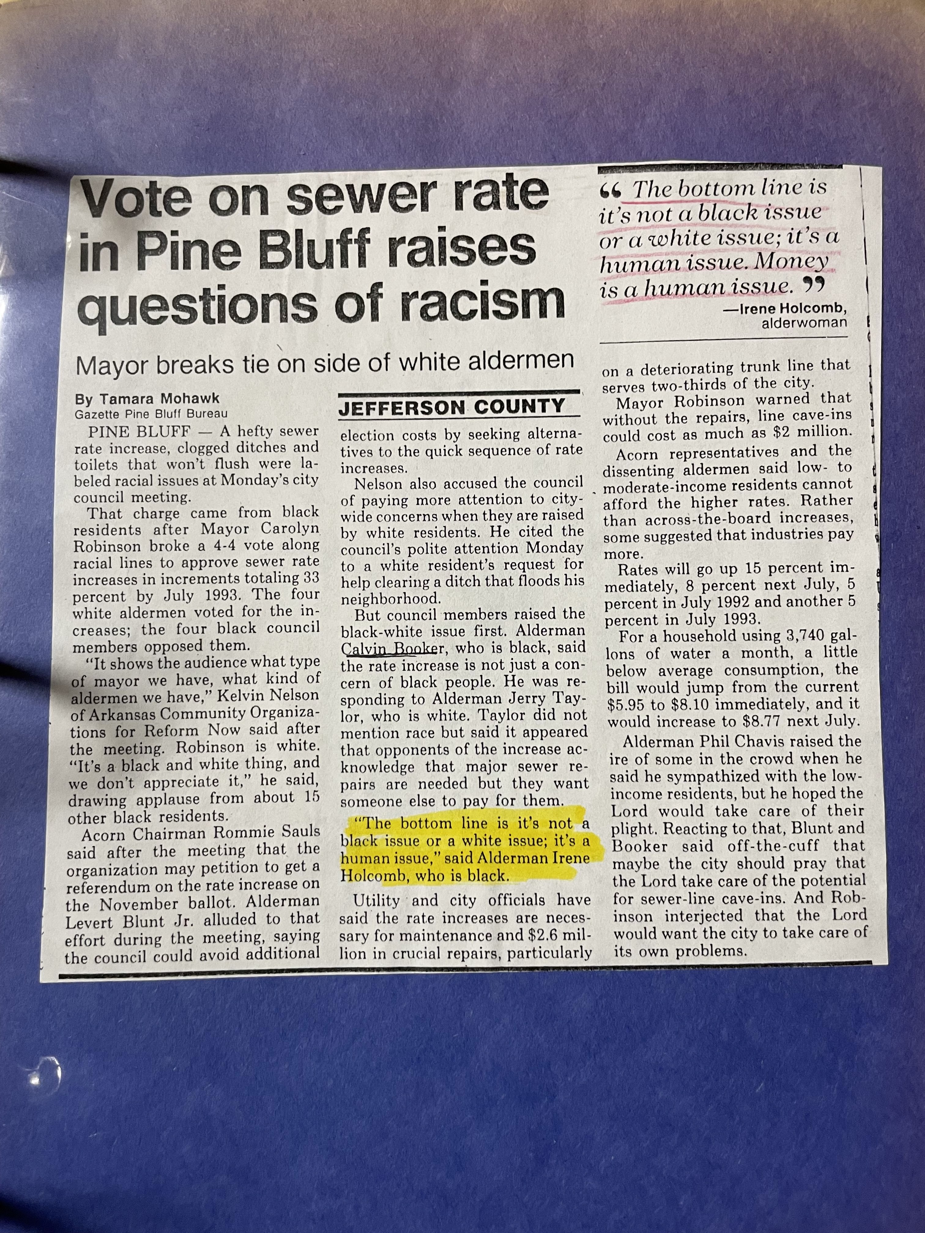 Photograph of a newspaper article titled, “Vote on sewer rate in Pine Bluff raises questions of racism,” in which Alderman Irene Holcomb is quoted.