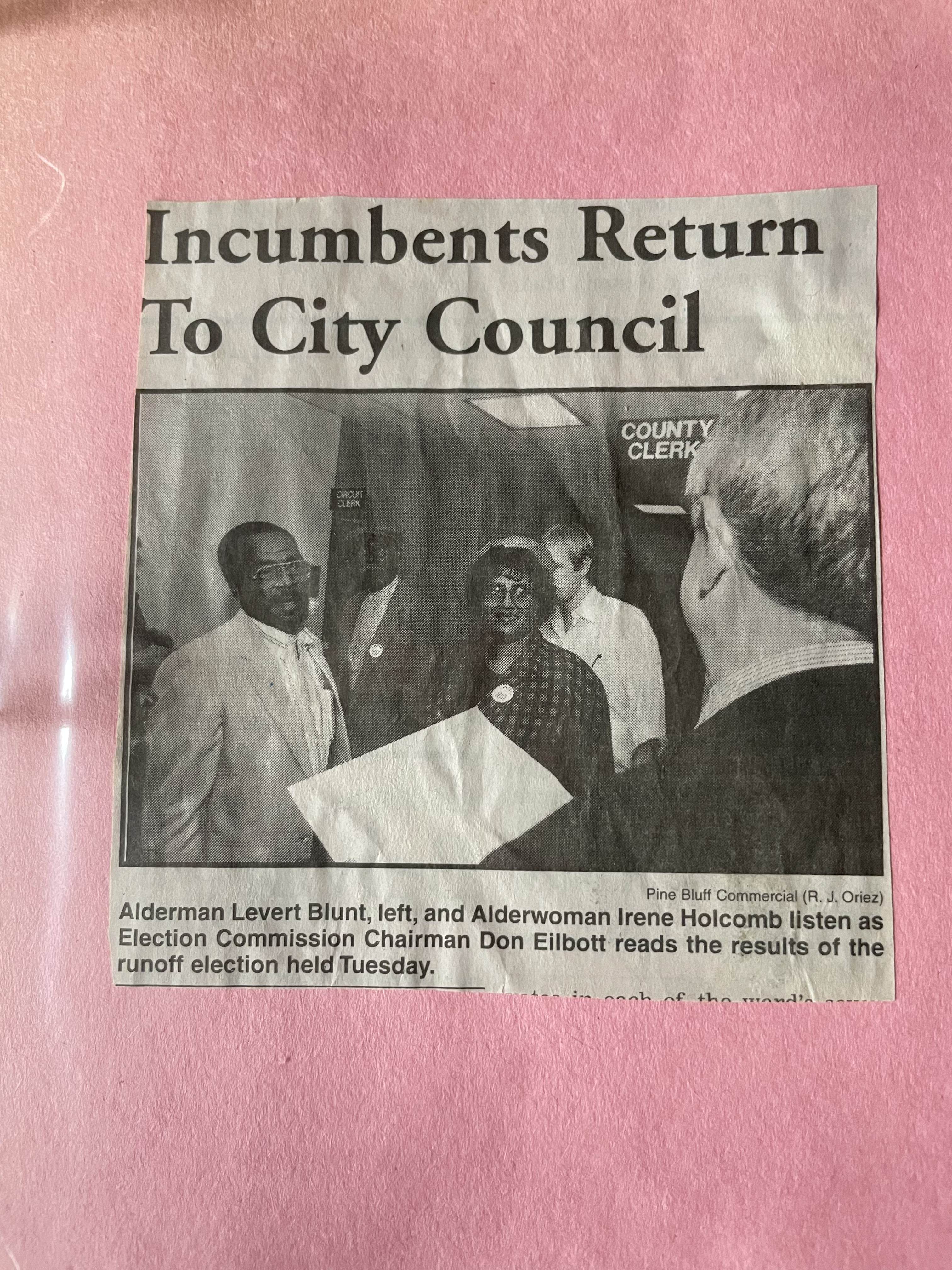 Photograph of a newspaper clipping from the Pine Bluff Commericial about Alderwoman Irene Holcomb and Alderman Levert Blunt’s return to city council.