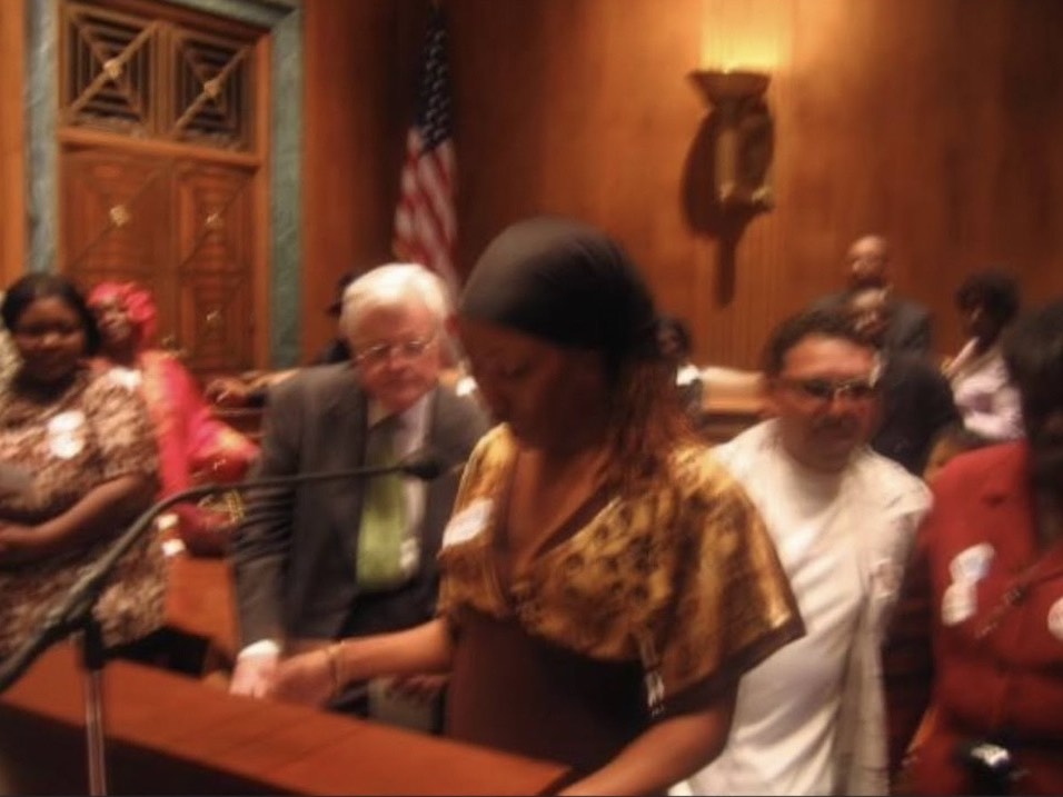 ACORN Florida member/leader Tameka Pierce at the U.S. Capital giving Senator Ted Kennedy an award for his activism.