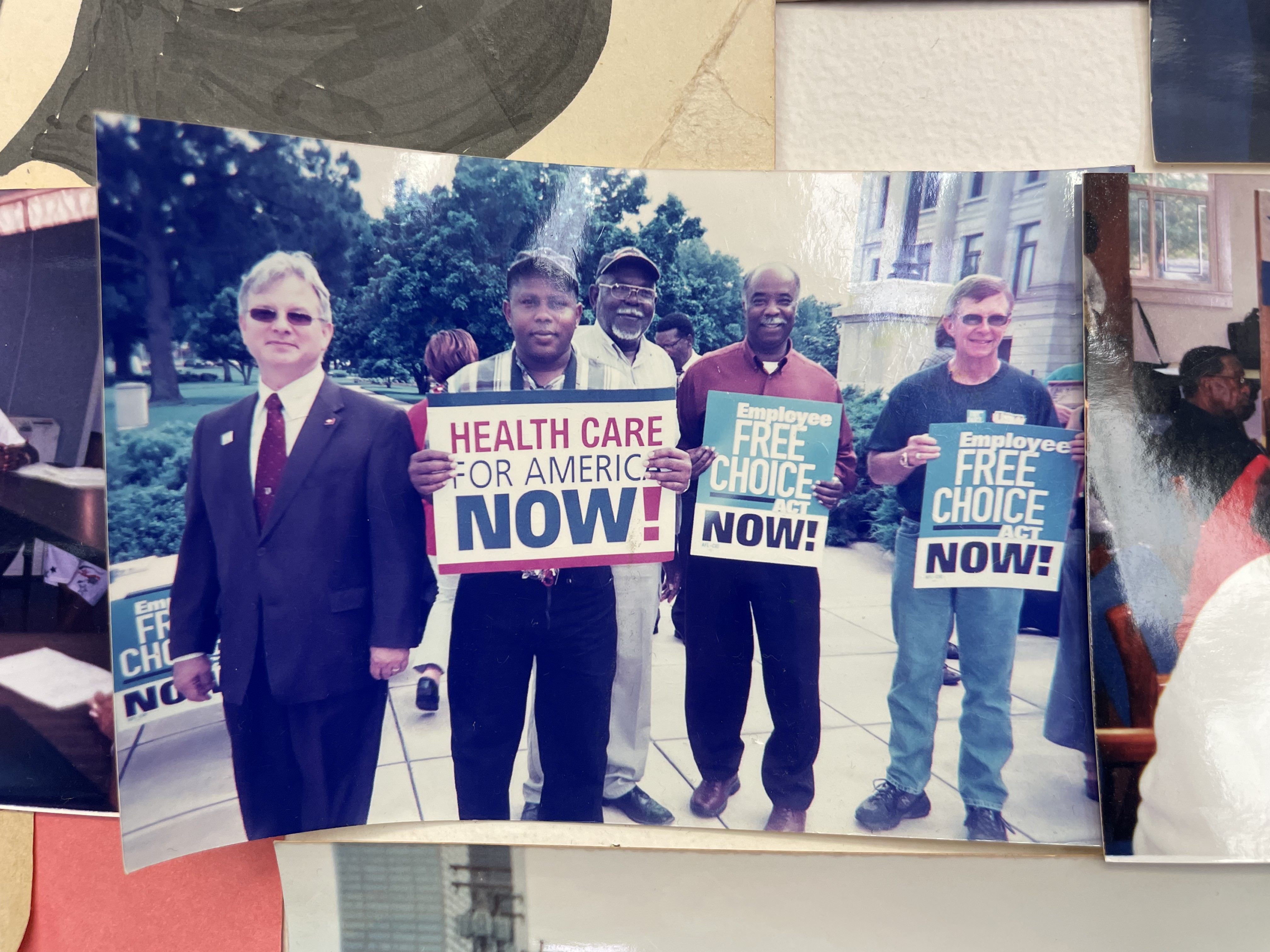 Photograph of an ACORN action hanging on the wall of the Arksansas Community Organizations (ACO) office in Little Rock, Arkansas.