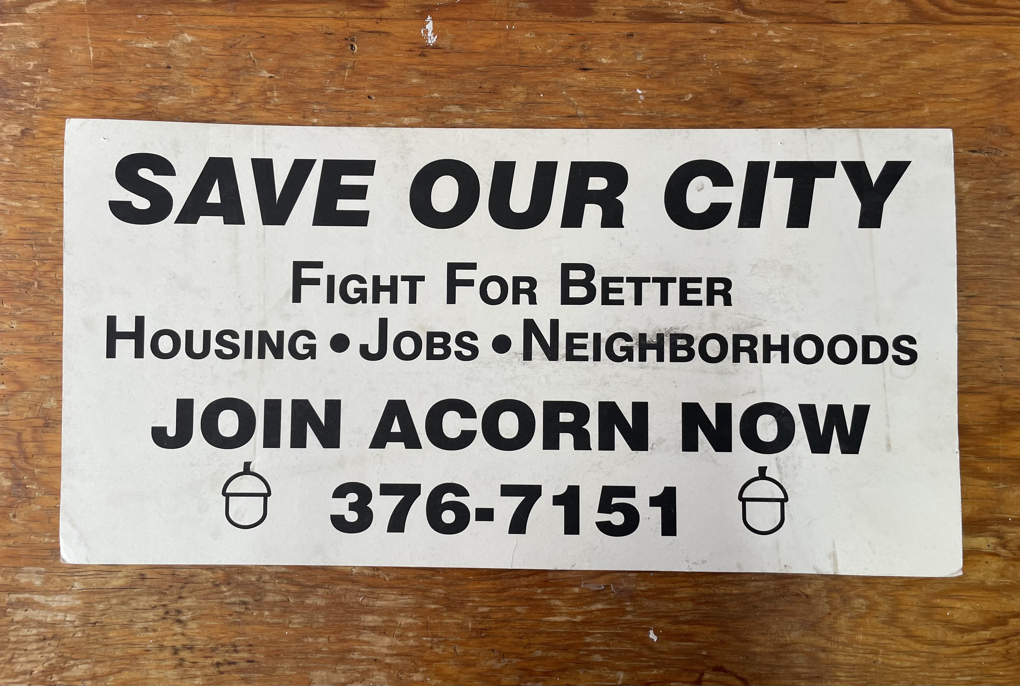 Photograph of a poster advertising ACORN.