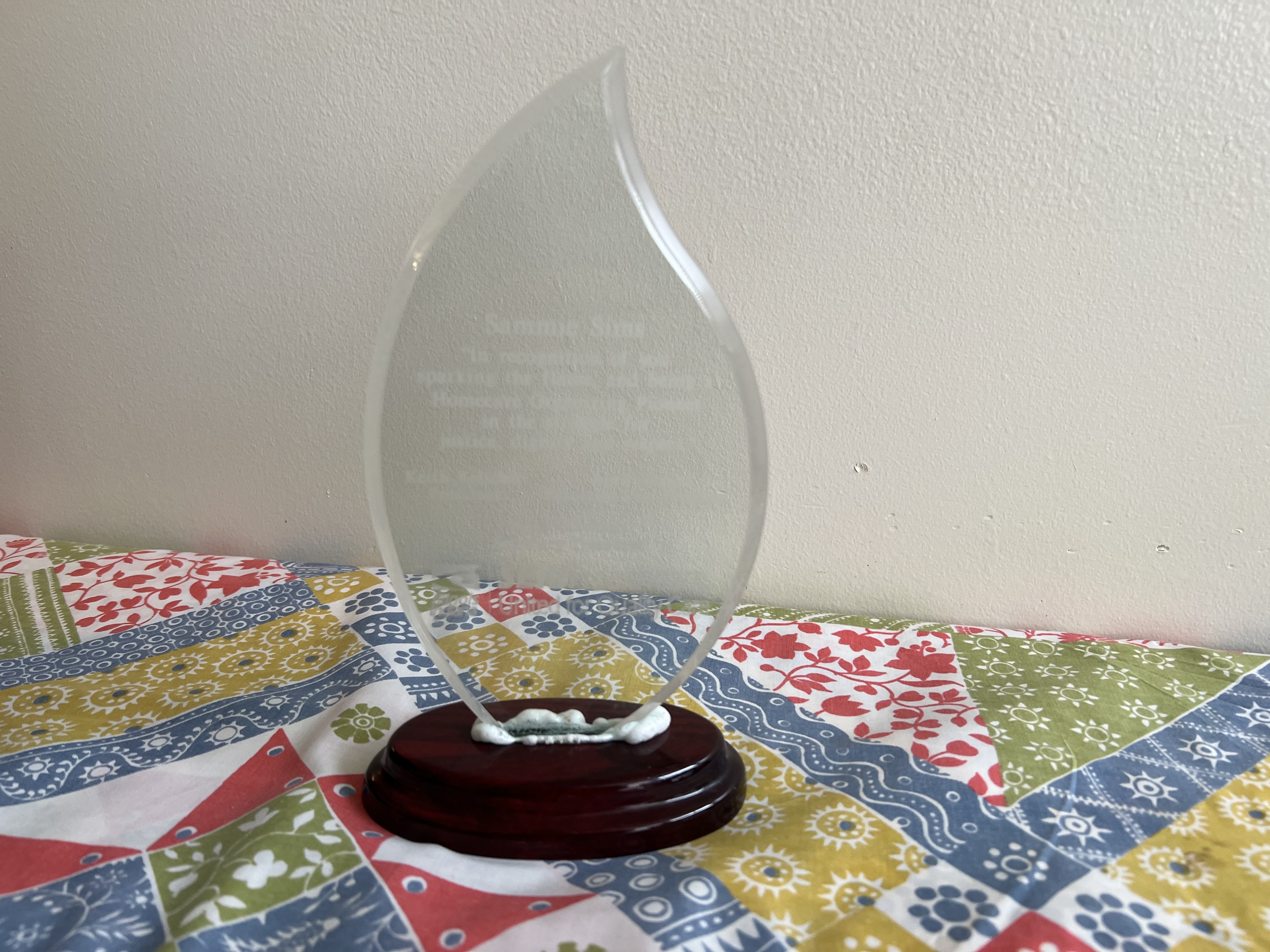 Photograph of an award given to ACORN/ULU organizer, Sammie Sims.
